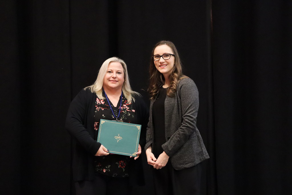 Pictured: Lindsey Sprague of Ladysmith Federal Savings & Loan (left) accepting the Certificate & Award from WBF Executive Director, Cassandra Krause (right).